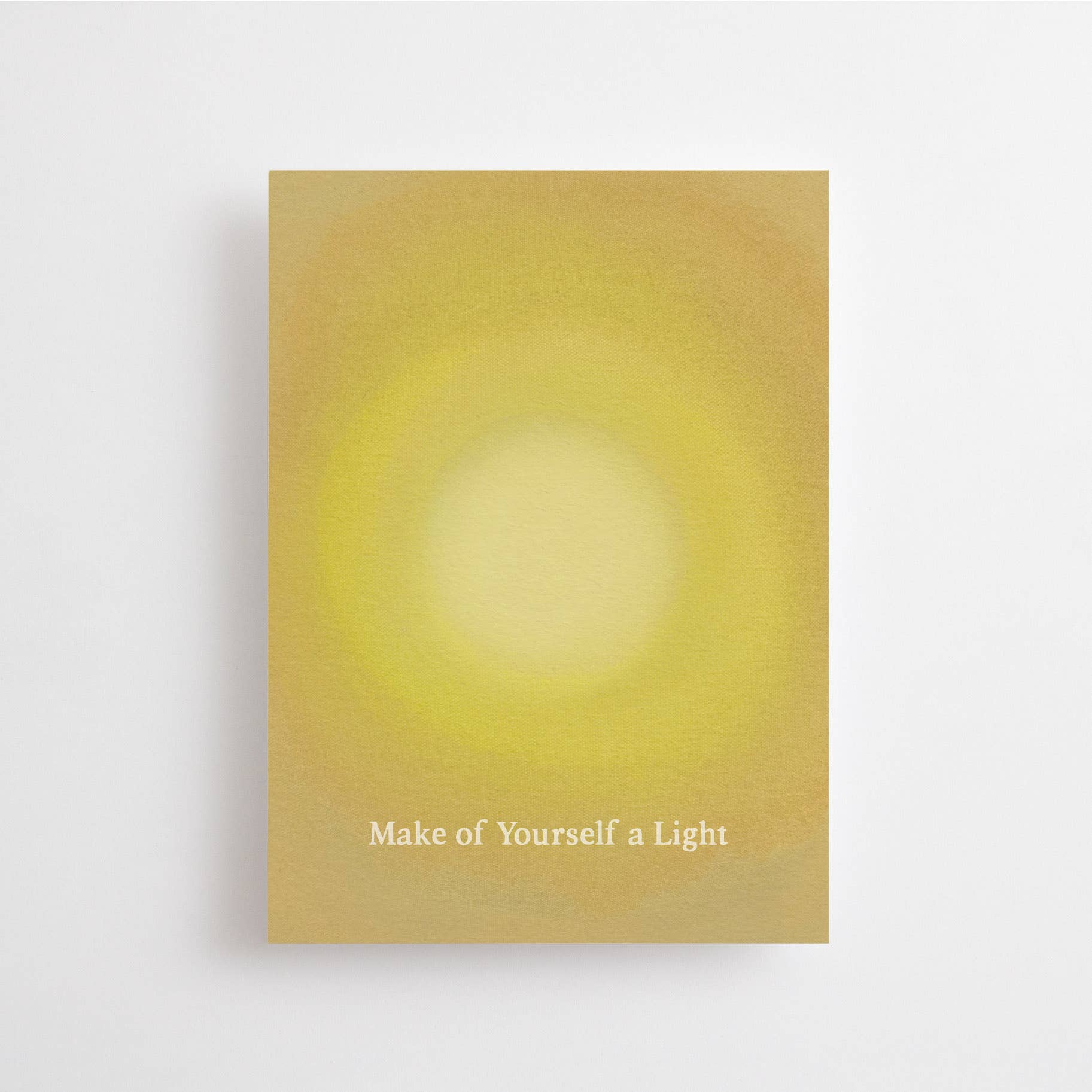 Postkarte „Make of Yourself a Light“ im DIN-A6-Format mit einem warmen gelben Lichtschein-Motiv und dem Schriftzug vor hellem Hintergrund.