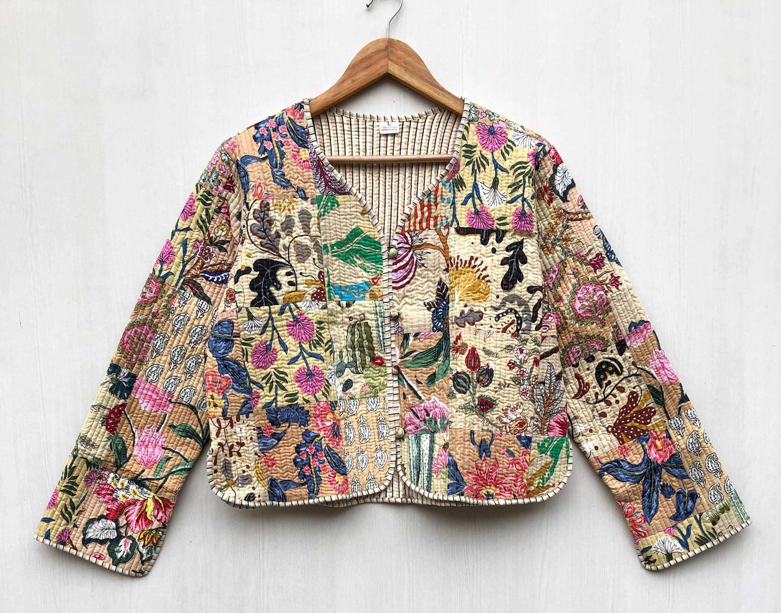 Wendbare gesteppte Patchwork Jacke aus Baumwolle Beige