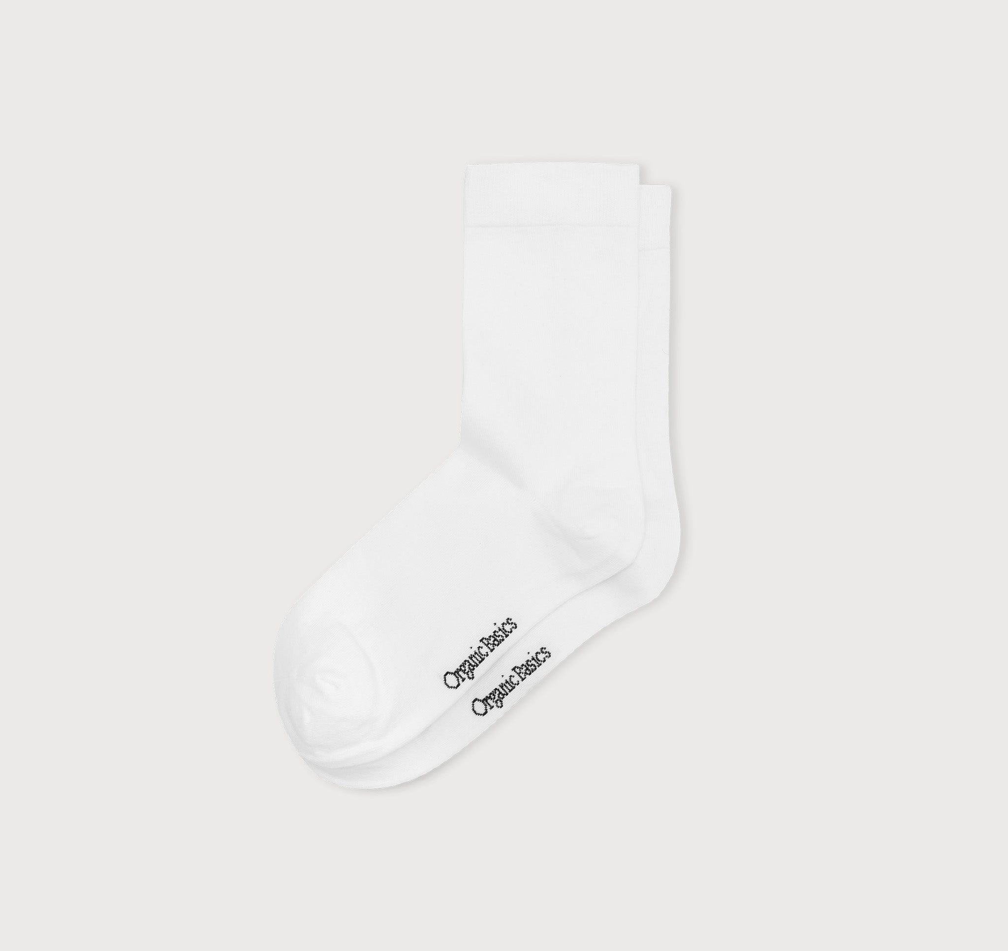 weiße Core Crew Socks in klassischer Crew-Länge an den Beinen eines Modells vor hellem Hintergrund.